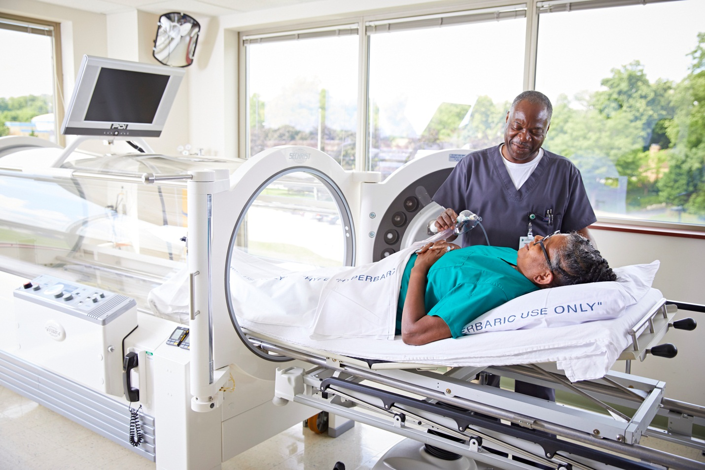 How does hyperbaric oxygenation therapy work for adults?